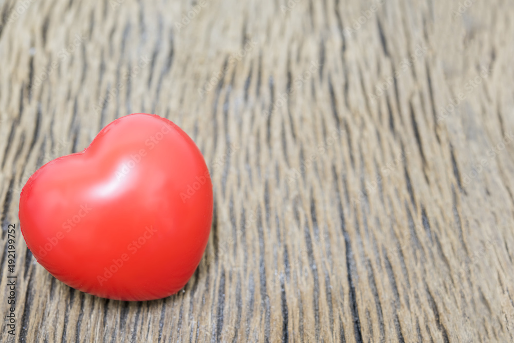 Red heart on the wooden background for copy space. Red heart on the wooden background for copy space.