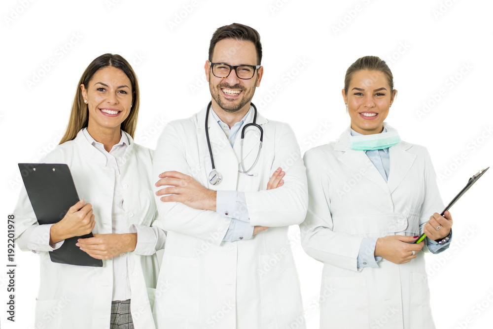 Portrait of three happy doctors who stand and smiling Portrait of three happy doctors who stand and smiling