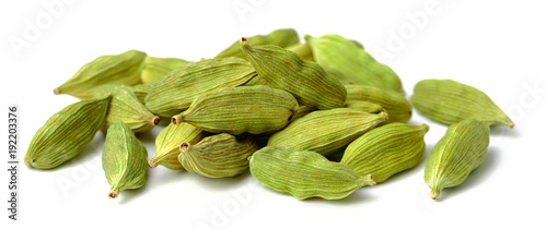 dried cardamom seeds isolated on white photo
