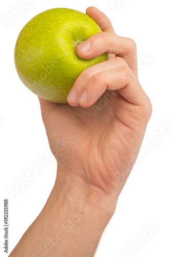 in a hand a green apple isolated on a white background