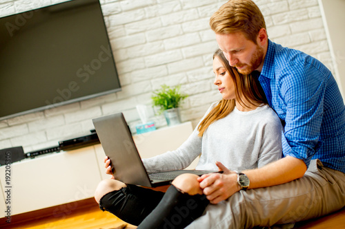 Loving couple sitting on th...