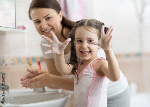 child girl and mother washi...