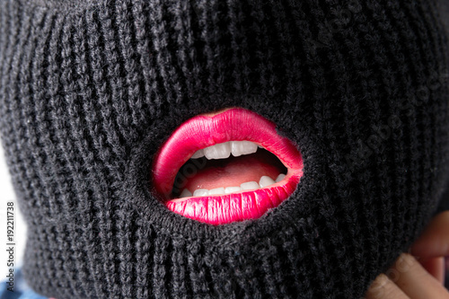 sexy bandit girl, fat model in balaclava, Woman Plus Size in shirt posing topless on white background. XXL female in black mask with lips tongue teeth