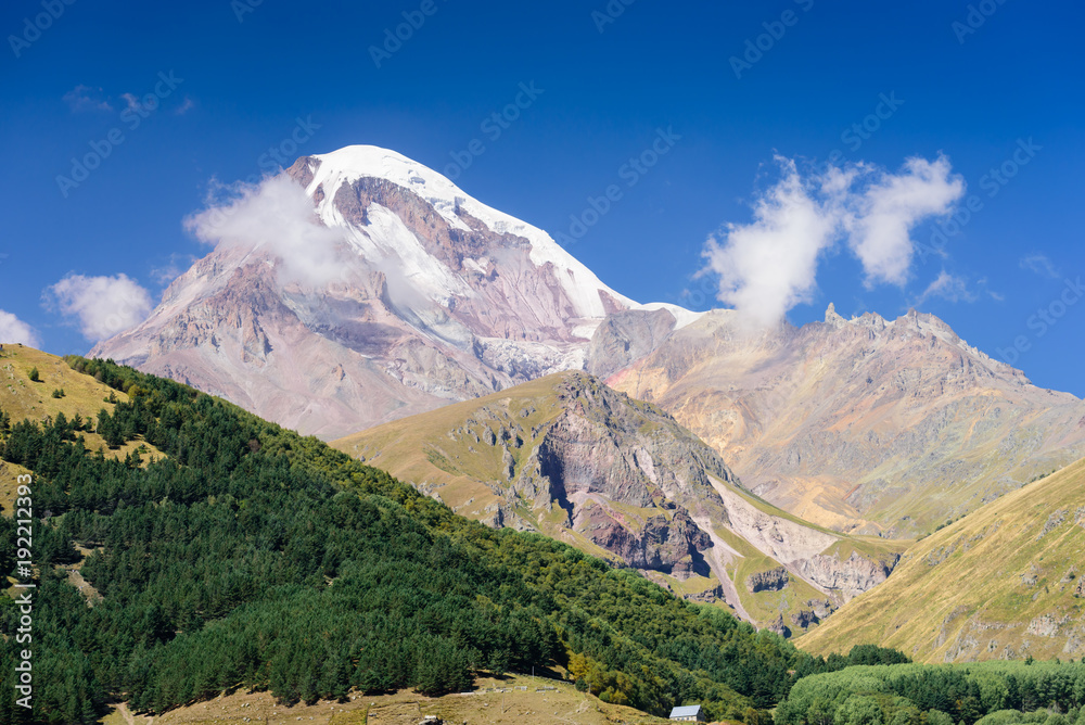 Mount Kazbegi is a popular natural attraction near Stepantsminda (Kazbegi) village, Georgia Mount Kazbegi is a popular natural attraction near Stepantsminda (Kazbegi) village, Georgia