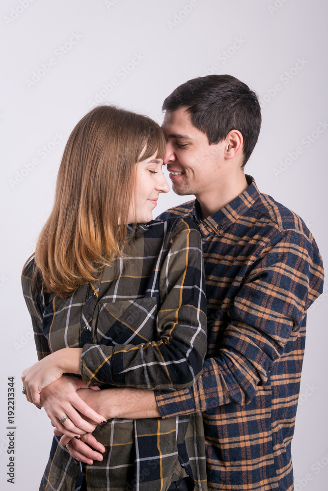 A young couple of lovers gently embrace each other, show their love. A young couple of lovers gently embrace each other, show their love.