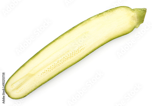 One green zucchini half top view isolated on white background long raw courgette cross section.