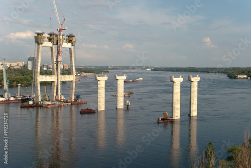 Fototapeta Naklejka Na Ścianę i Meble -  Construction of a large bridge across the great Dnieper River