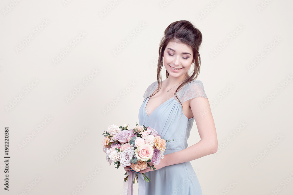 Beautiful female model with perfect fashion makeup and hairstyle. Elegant female hairstyle for the wedding.
