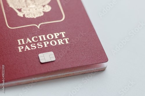 International passport with chip on white background. The electronic identification chip.