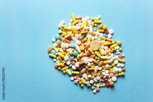Colorful pills on a blue background