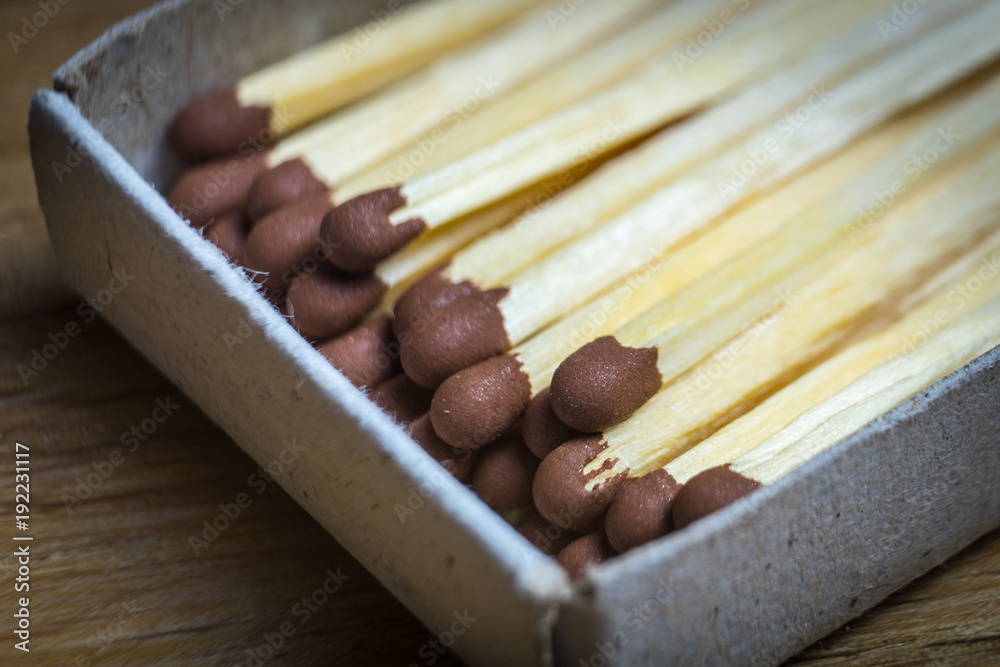 The open boxes of matches are photographed close-up.