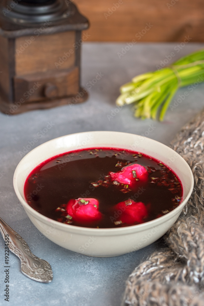 Traditional polish clear red borscht with dumplings. Traditional polish clear red borscht with dumplings.