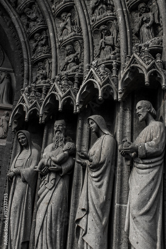 Detail of the architecture of a cathedral with saints standing up 