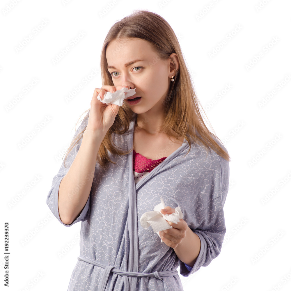 Young beautiful woman in bathrobe cold runny flu napkin