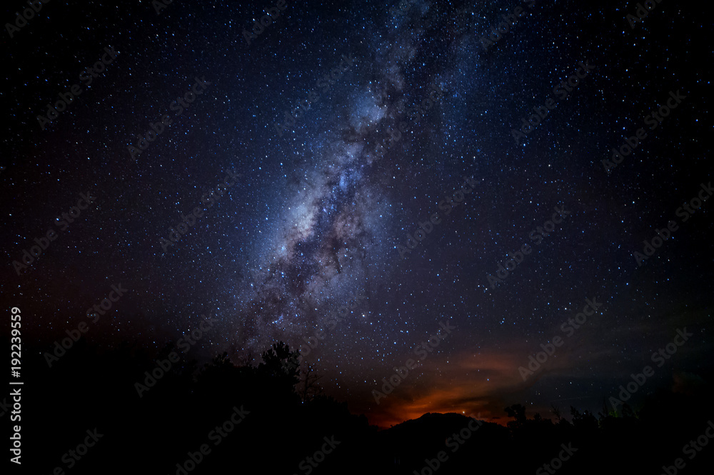 starry night sky with milky way. image contain soft focus, blur and noise due to long expose and high iso. starry night sky with milky way. image contain soft focus, blur and noise due to long expose and high iso.