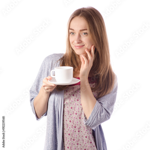Young beautiful woman in a bathrobe with a cup of tea coffee