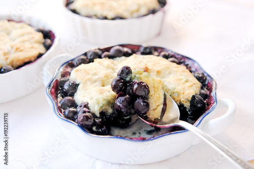 Individual servings of fresh blueberry cobbler © nebari