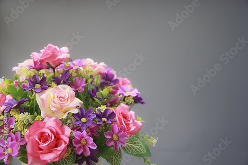 Pink rose bouquet isolated on gray background, soft focus