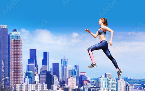 Athlete running upstairs over skyscrapers rooftops