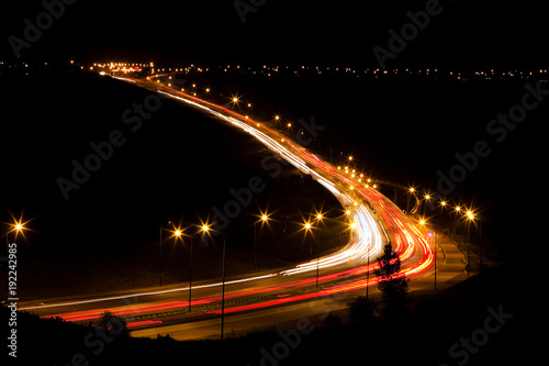 Long exposure of cars on a nighttime highway