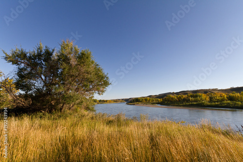 Prairie field backdropped by a river