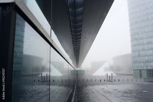 winter in the mirror, empty street through the glass of a building photo