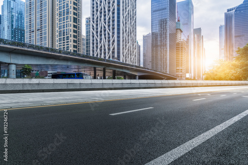 Empty urban road and modern skyline.