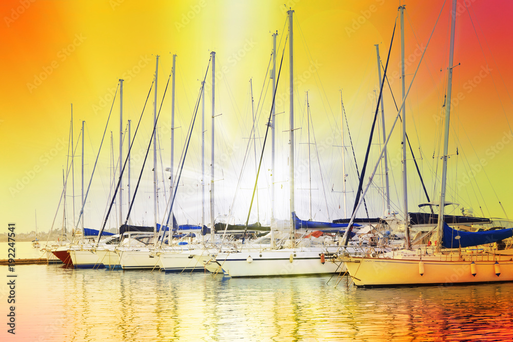 Mooring of sailboats at sunset 