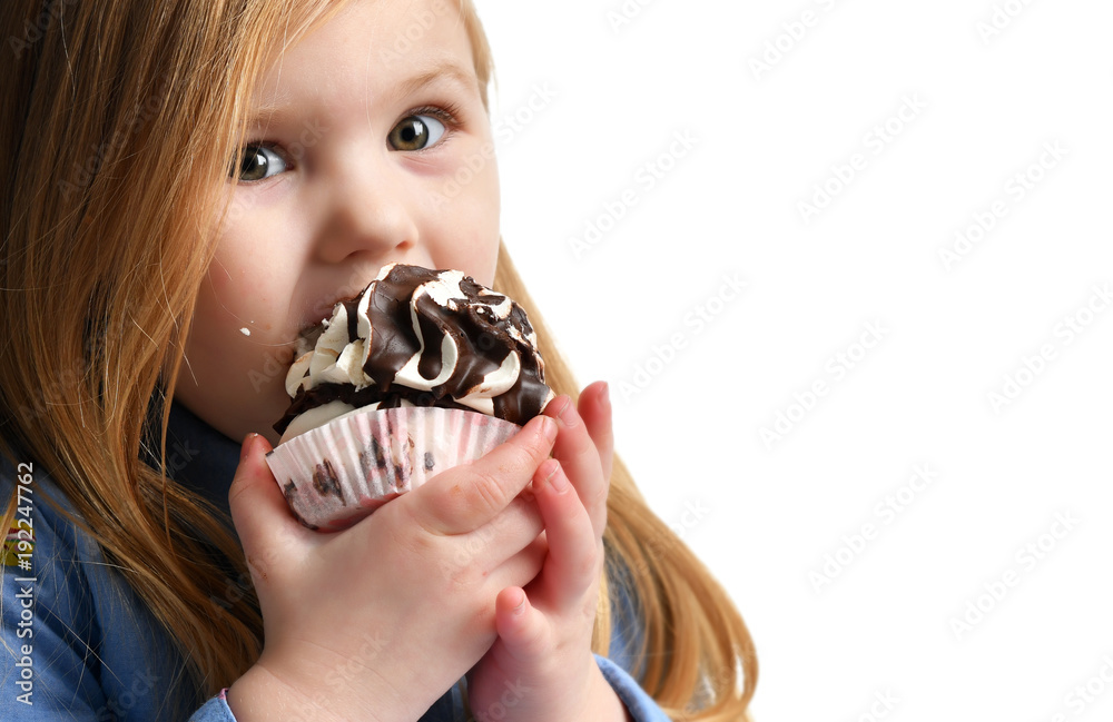 Three years girl kid eat sweet chocolate cake celebrating in birthday cap isolated Three years girl kid eat sweet chocolate cake celebrating in birthday cap isolated