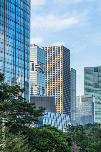 modern office building with green trees. © hallojulie