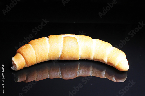 Whol mango on black reflective studio background. Isolated black shiny mirror...