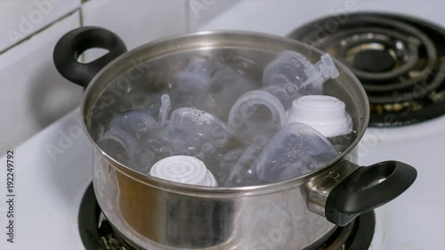 Sterilizing a breast pump and babies milk bottles in boiling water