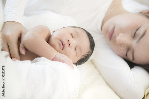 Mother and baby on the bed,Concept of love and family