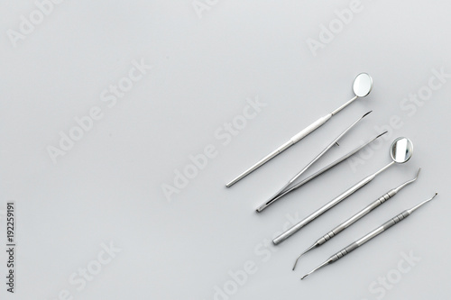Dentist tools. Teethcare  dental health concept. Grey background top view copy space