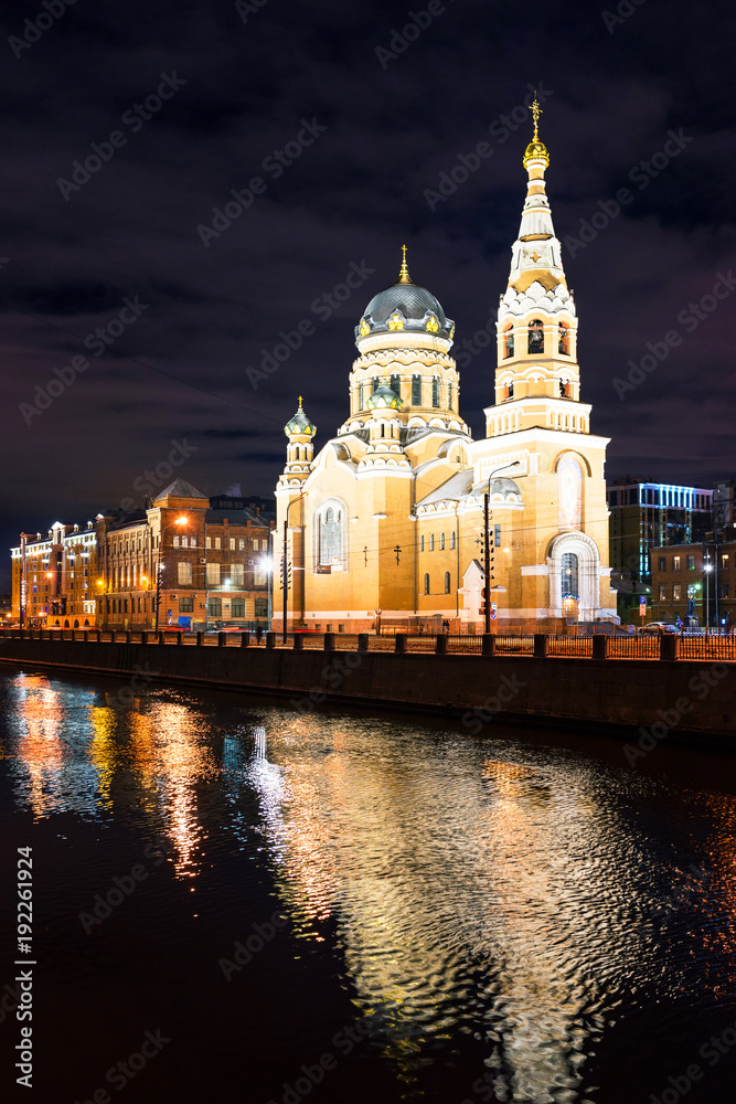 Saint Petersburg. The Church of the Resurrection of Christ on embankment of Obvodniy Canal on winter evening. Beautiful cityscape with a reflection of the cathedral in the canal water