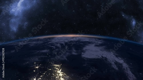 Slow sunrise over Earth seen from Space, time-lapse, 4K