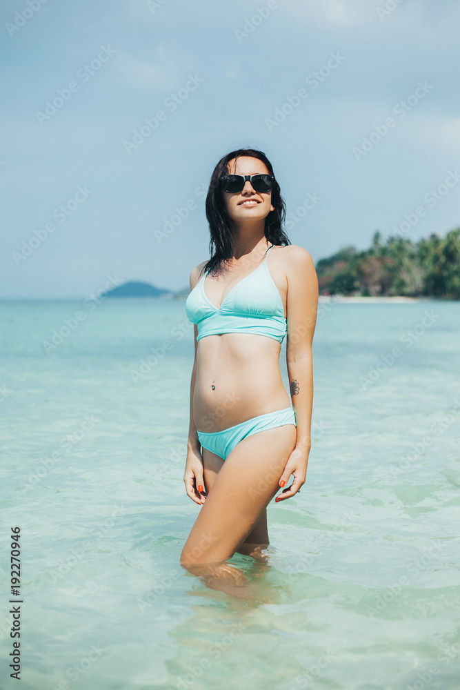 beautiful girl in bikini and sunglasses at tropical sea resort beautiful girl in bikini and sunglasses at tropical sea resort