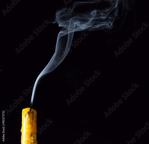 Yellow Candle with white smoke on black background , Select focus for adjustment  make smoke brush tool.