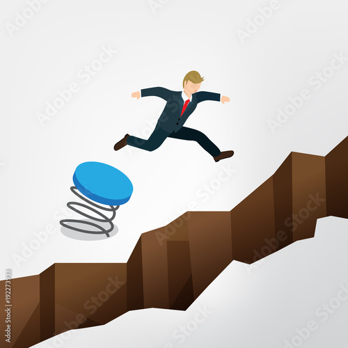 businessman jumping over the chasm