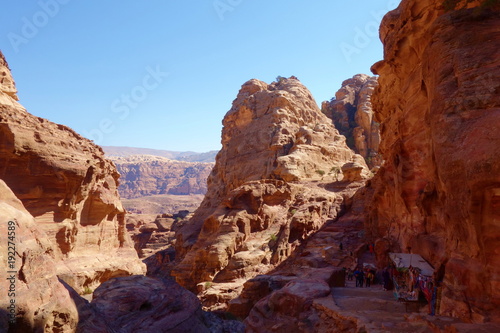 Ancient abandoned rock city of Petra in Jordan with local shop in the background