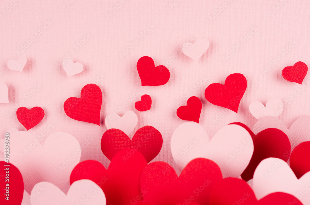 Paper red and pink hearts with blur perspective on soft pink color background. Valentine day concept for design.