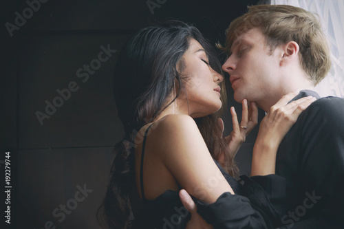 Romantic couple touching and kissing each other