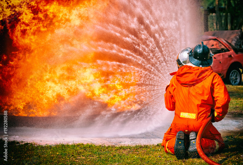 Valokuva Firefighters water spray by high pressure nozzle in fire, Fire and rescue