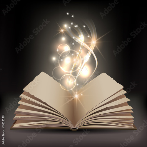 Open book with mystic bright light