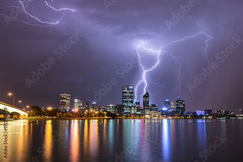 Perth city in Western Australia at night with multiply lightning strikes