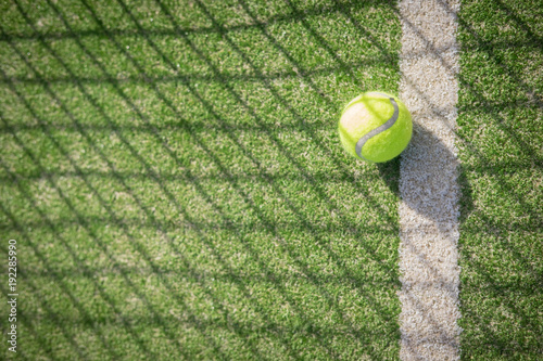 Paddle tennis court and net with a ball