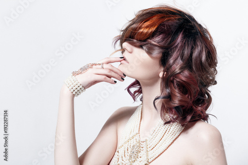 Portrait of a beautiful female model with red hair
