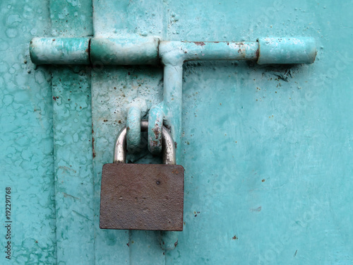 Quadro su tela Padlock on locked metal doors. Home security