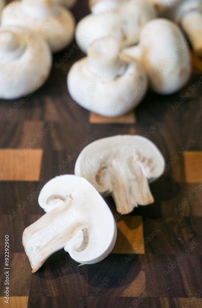 Heap of mushrooms: sliced champignons as ingredients for cooking dinner Heap of mushrooms: sliced champignons as ingredients for cooking dinner