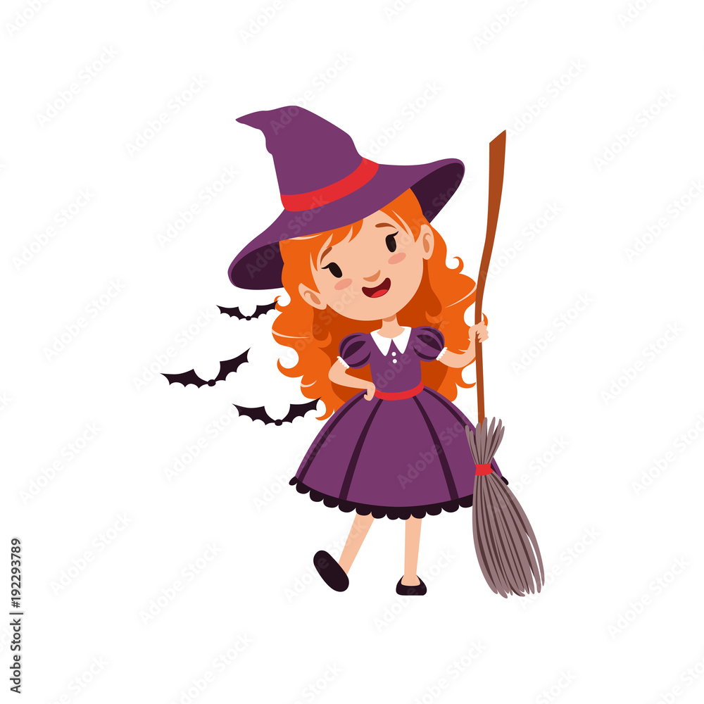 Joyful red-haired girl witch standing with broom and wearing purple dress and hat. Kid character in costume surrounded with black bats. Vector flat cartoon illustration on white.